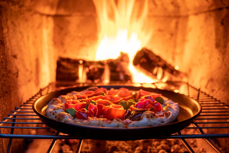Chef preparing fresh deep dish pizza at Pequod's